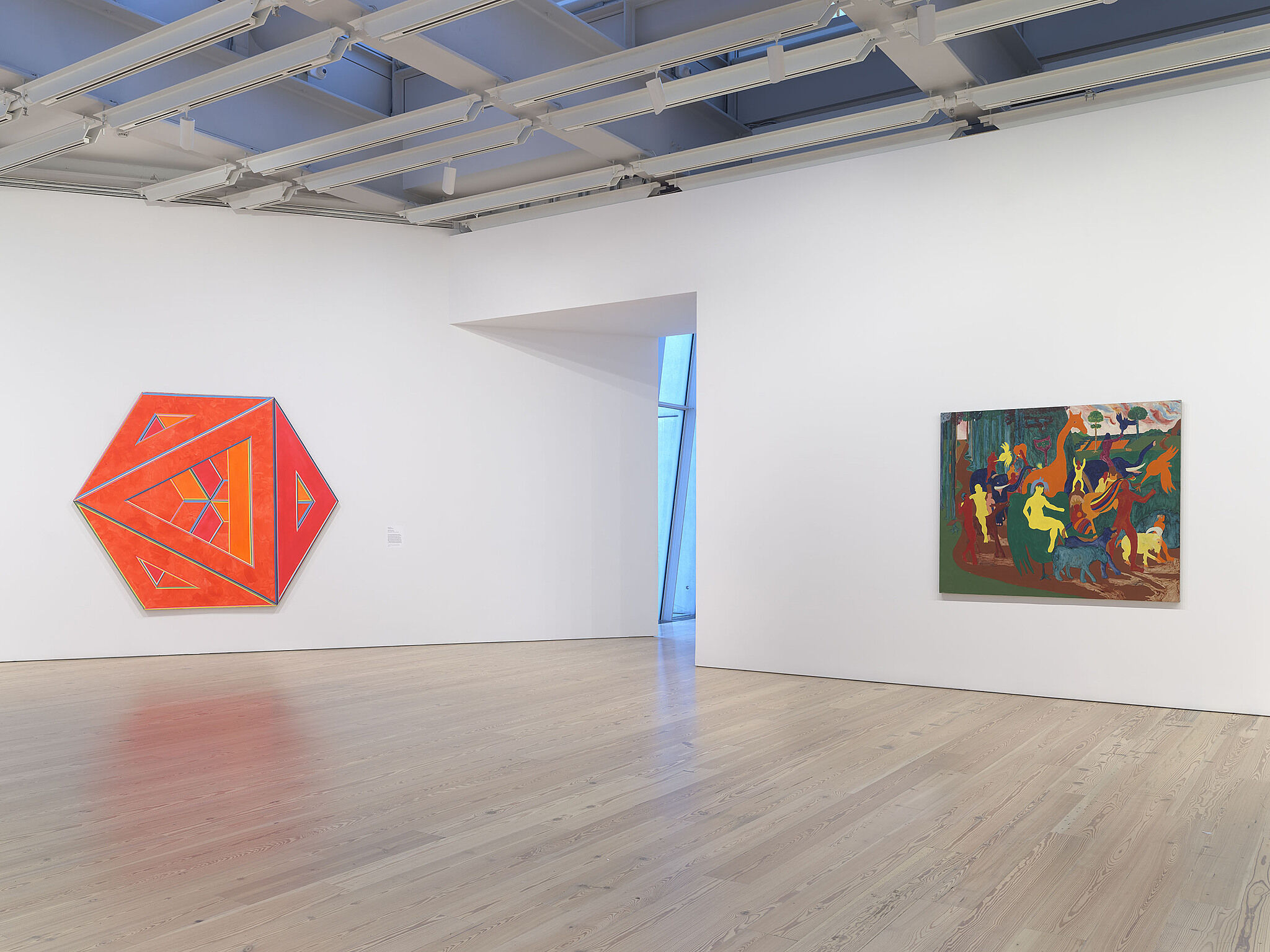 An image of the Whitney galleries with paintings on the wall